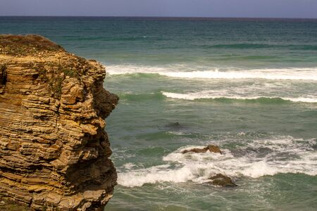 tip of a cliff, very herosionada and still endures year after year the envestidas of the Atlantic oceanの写真素材