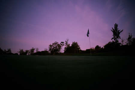 night photography where you can see the shadows of the environment that surrounds the green of this splendid golf courseの写真素材