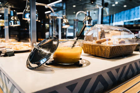 bowl of soup exposed on a buffetの写真素材