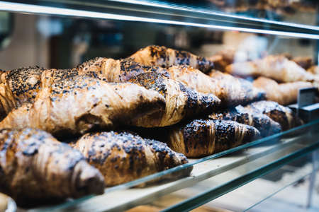 assortment of croissants in a bakeryの写真素材