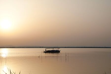 Reflections of the sunset in the lagoon. Sunset lightsの写真素材