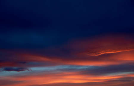 Sunset. Heaven, orange sky. Sun rays. Wallpaper. Clouds.の写真素材