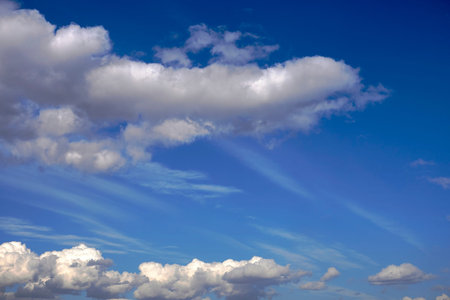 Sky full of dark white clouds. Horizontal white, blue and gray background