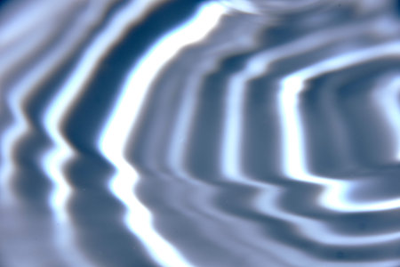 An abstract background of undefined shapes with various shades and waves, Wallpaper. Concentric...