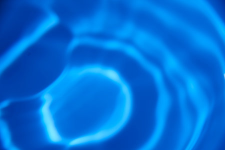 An abstract background of undefined shapes with various shades and waves, Wallpaper. Concentric circles, madness, undefined shapes, waves, blue, green, magenta, cyan, blue, green magenta cyanの写真素材