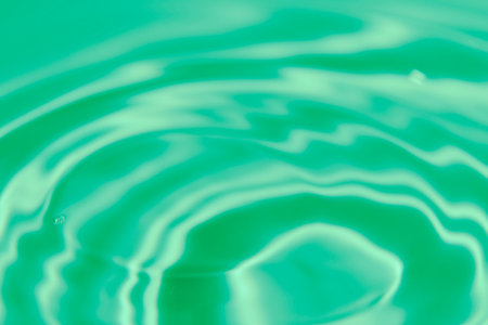 An abstract background of undefined shapes with various shades and waves, Wallpaper. Concentric circles, madness, undefined shapes, waves, blue, green, magenta, cyan, blue, green magenta cyanの写真素材