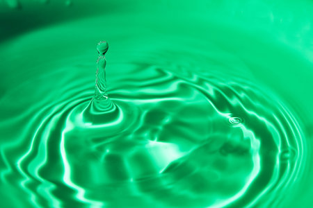 124.One or more drops of water splashing into waves and undefined shapes.Wallpaper.Concentric...