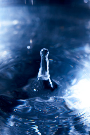 131.One or more drops of water splashing into waves and undefined shapes.Wallpaper.Concentric circles, madness, undefined shapes, waves, blue, green, magenta, cyan, metal, grayの写真素材