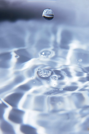 013.One or more drops of water splashing into waves and undefined shapes.Wallpaper.Concentric...