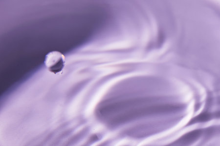 051.One or more drops of water splashing into waves and undefined shapes.Wallpaper.Concentric circles, madness, undefined shapes, waves, blue, green, magenta, cyan, metal, grayの写真素材