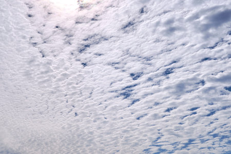Blue sky full of white clouds, sunny day.
