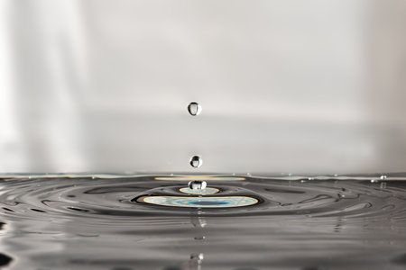 205.Three Droplets Impacting Water with Rainbow Splashの写真素材