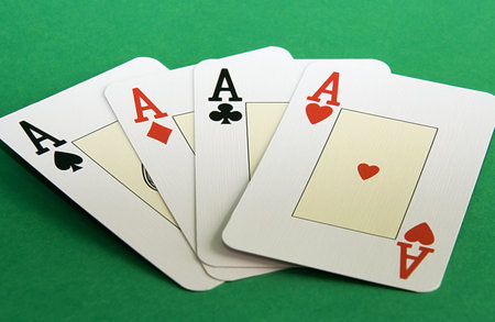 4 Aces on a green background