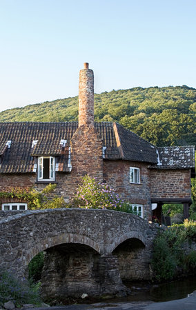 Old bridge leading to an old english cottage