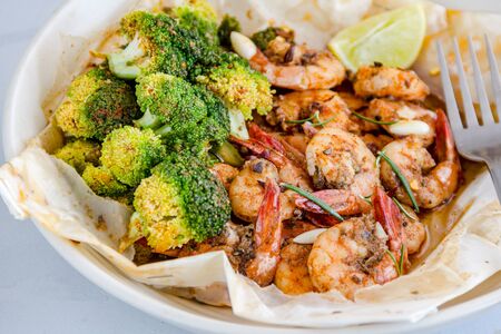 Baked Shrimp and Broccoli in a Packet with Lemon Close Up Horizontal Photoの写真素材