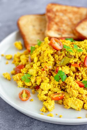 Scramble Tofu with Toasted Bread Vertical Close Up Photo, Vegan Food, Veganism, Food Photographyの写真素材