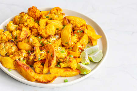 Indian Style Roasted Aloo Gobi, Potatoes and Cauliflower Close Upの写真素材