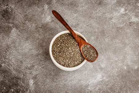 Chia Seeds / Salvia Hispanica in a Bowl and Spoon Directly Aboveの写真素材