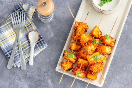 Roasted Pineapple Skewers with Condiment Directly Above Photoの写真素材