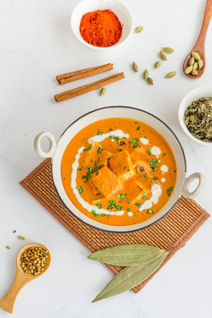 Paneer Butter Masala - Rich and Creamy Dish of Indian Cottage Cheese made with Tomato, Butter and Cashew Pasteの写真素材