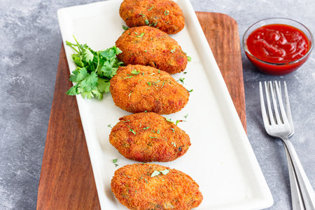 Vegetable Cutlets with Tomato Ketchup Garnished with Cilantro