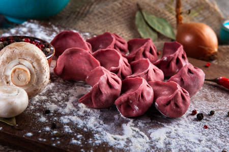 red dumplings, dumplings on a wooden boardの写真素材