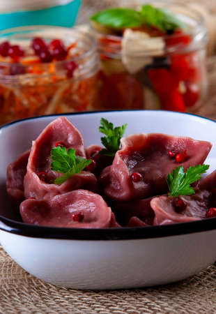 red dumplings, dumplings on a wooden boardの写真素材