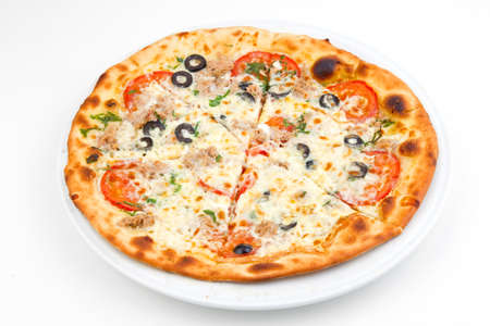 Italian pizza with melted mozzarella cheese, olives and tomato garnished isolated on white backgroundの写真素材