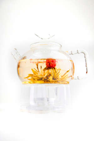 glass transparent teapot with flower light delicious teaの写真素材