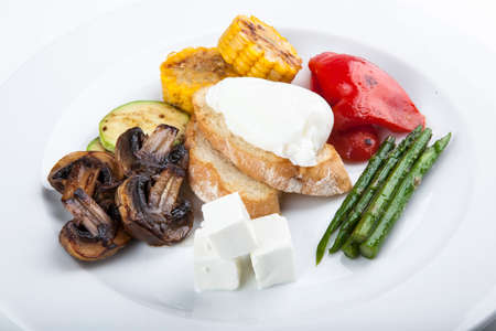 grilled vegetables with asparagus cheese and poached eggの写真素材