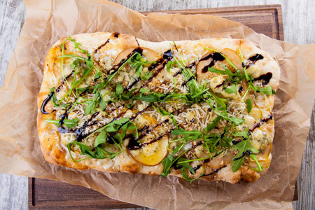 Puffy pastry pincers with pear walnut cheese and sweet rocket sauceの写真素材