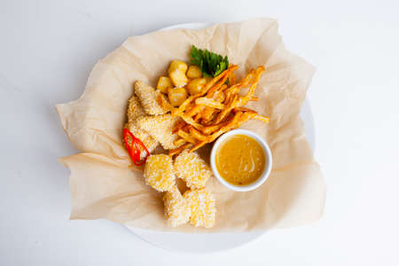 beer snacks on paper with sauceの写真素材