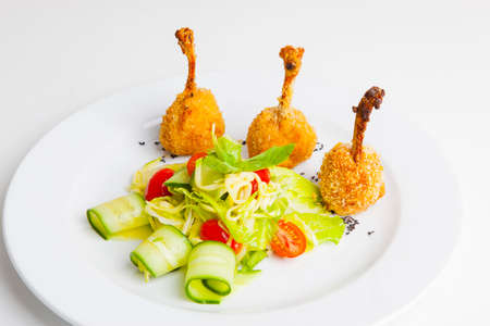 Kiev cutlets with vegetables and sauceの写真素材
