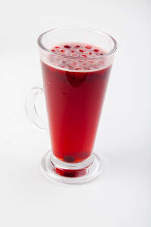 hot berry drinks in a glass glass on a white backgroundの写真素材