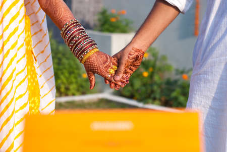 Indian Married Couple holding hands.の写真素材
