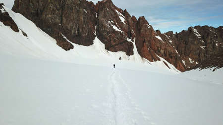 A large group of climbers climb to the top.の写真素材