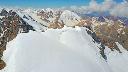 Huge snow mountains. View from a drone.の写真素材