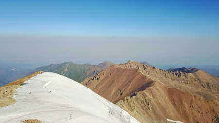 Huge snow mountains. View from a drone.の写真素材