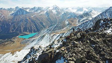 Top view of a group of tourists on a peakの写真素材