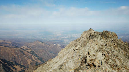 Top view of a group of tourists on a peakの写真素材