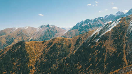 Autumn mountains covered with snow in places.の写真素材