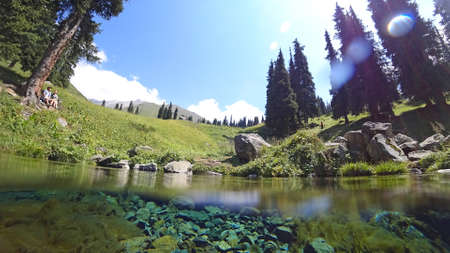 An incredible underwater world of a mountain riverの写真素材