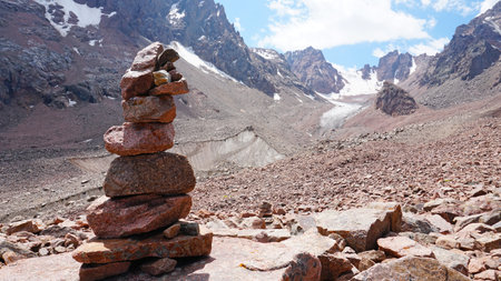 A pyramid of stones as a pointer in the mountainsの写真素材