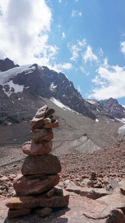 A pyramid of stones as a pointer in the mountainsの写真素材
