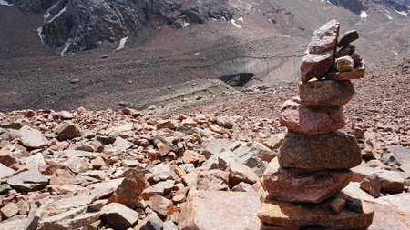 A pyramid of stones as a pointer in the mountainsの写真素材