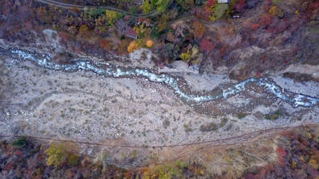 Autumn mountain forest. Top view from a drone.の写真素材