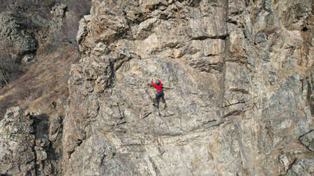 Rock climbing training on steep slope in mountainsの写真素材