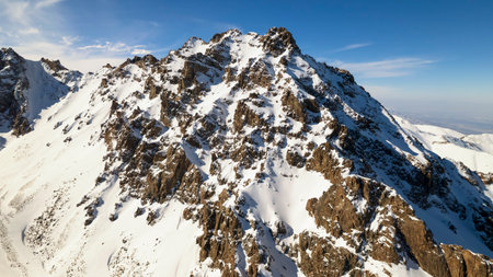 High snow capped mountains among large glaciers.の写真素材