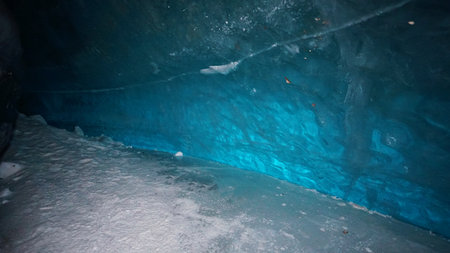 A huge corridor inside an ice cave in mountainsの写真素材
