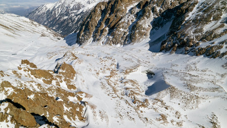 A huge glacier in the mountains and touristsの写真素材